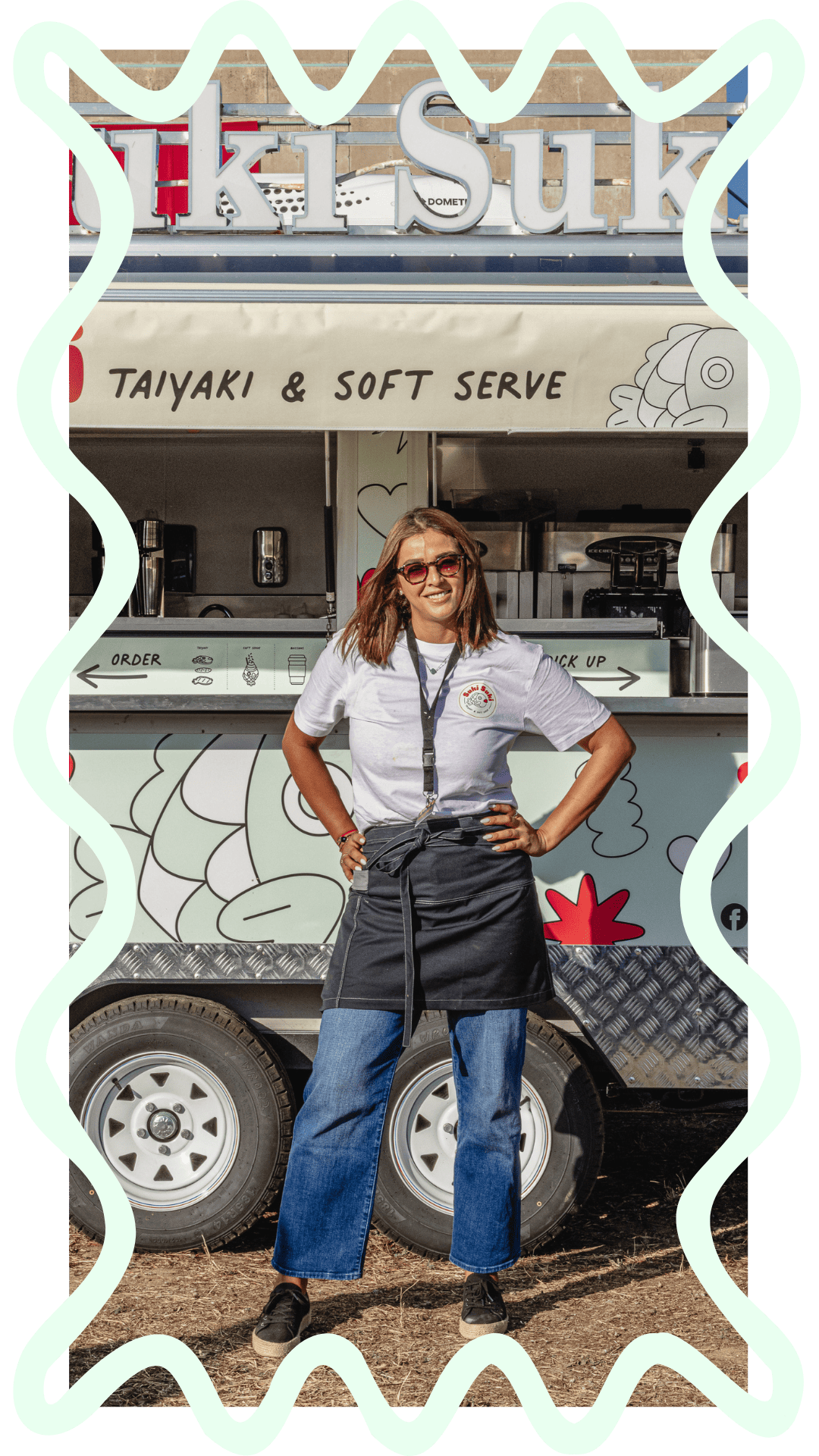 Lyna, founder of Suki Suki, in front of the colorful taiyaki food truck in Switzerland