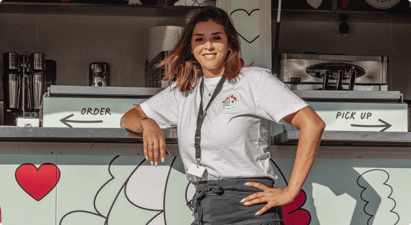 Lyna, founder of Suki Suki, in front of the colorful authentic taiyaki food truck in Switzerland